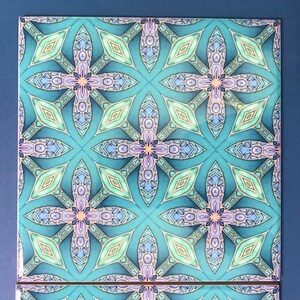 May include: A teal blue square tile with a repeating geometric pattern of overlapping diamonds and flowers. The pattern is in shades of teal, green, purple, and gold.