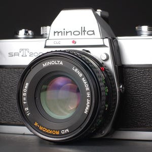 Minolta SRT 200 35mm SLR Camera with a Rokkor 50mm f/2 Lens, New Light Seals