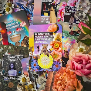 May include: A collection of colorful oracle cards with floral and artistic elements. The cards feature various illustrations, including a leopard, flowers, and inspirational text such as "Believe in Yourself" and "Be Honest With Yourself". The overall aesthetic is vibrant and whimsical.