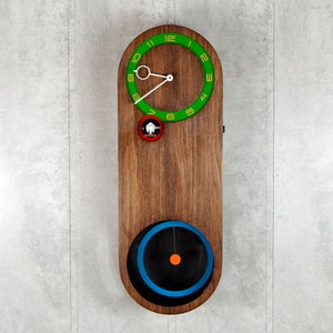 Modern cuckoo clock, multicolored, round big pendulum