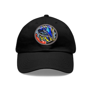 May include: A black baseball cap with a colorful graphic of a dragon's head on the front. The dragon has blue, yellow, red, and white scales.