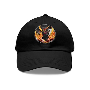 May include: Black baseball cap with a circular patch featuring a red and black figure with horns, holding a scythe, surrounded by flames.