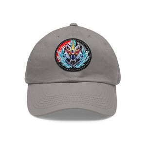May include: A gray baseball cap with a black and white wolf head graphic on the front. The graphic is surrounded by a circle with the text "AVATAR" in red and white.