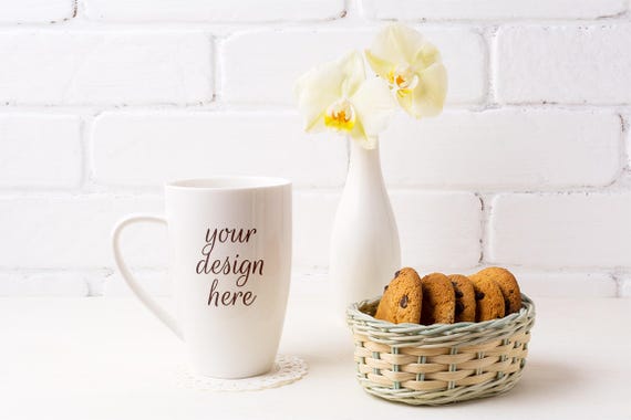 White Coffee Cappuccino Mug Mockup With Soft Yellow Orchid White Coffee Cappuccino Mug Mockup With Soft Yellow Orchid