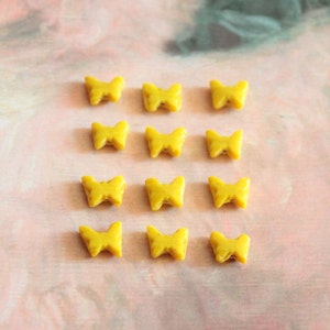 12 vintage yellow ceramic beads, butterfly-shaped and glazed, 1841