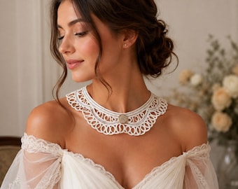 Vintage white collar in lace embroidery, decorated with an old button,
