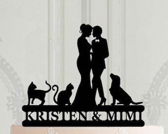 May include: Black silhouette cake topper of a lesbian couple with two cats and a dog. The topper says "Kristen & Mimi" at the bottom.