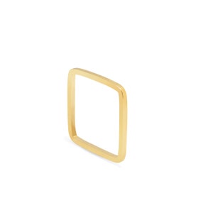May include: A gold square ring with a smooth, polished finish.