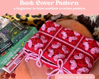May include: A red and pink crochet book cover with a ribbon tie closure. The cover is made of granny squares and is next to a stack of books. The text "Ribbon Tie Granny Square Book Cover Pattern" is at the top.