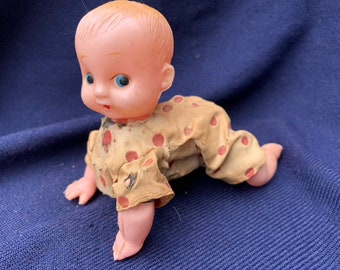 crawling scary baby doll