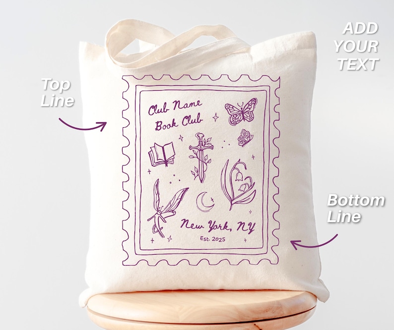 May include: Cream-colored tote bag with a purple stamp-like design. The design includes illustrations of a book, sword, butterflies, and flowers. Text on the bag reads "Club Name Book Club, New York, NY, Est. 2025".