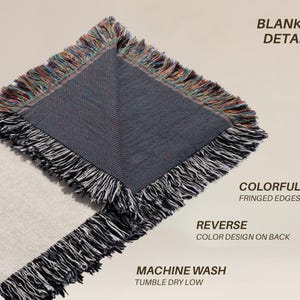 May include: Close-up of a woven blanket with a gray reverse side and fringed edges. The edges feature a colorful fringe, while the front is a light gray. The blanket has the text "BLANKET DETAILS", "COLORFUL FRINGED EDGES", "REVERSE COLOR DESIGN ON BACK", and "MACHINE WASH TUMBLE DRY LOW".