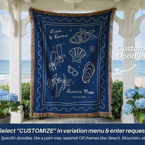 May include: A navy blue throw blanket with white custom doodles, including champagne flutes, seashells, and palm trees. The blanket has a fringed edge and the text "Liam & Emma" and "Riviera Maya January 2026". The text "Custom Doodles" is also visible.
