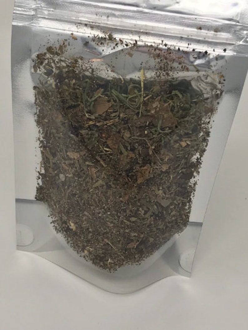May include: A clear plastic bag filled with a mixture of dried herbs and leaves. The herbs are a mix of brown, green, and tan.