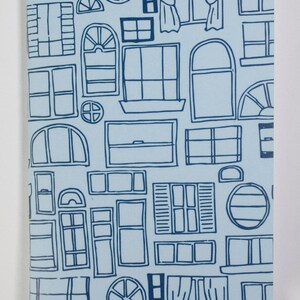 May include: A light blue background with a repeating pattern of various window shapes in dark blue. The windows are drawn in a simple, hand-drawn style.