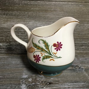 Vintage green and white floral creamer