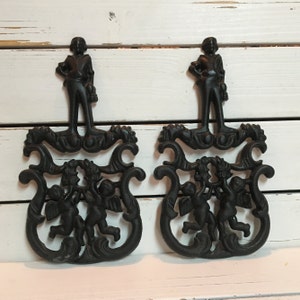 Black wrought iron cherub hot plate holder/ Trivet holder black iron cherub 1950