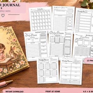 May include: A set of planner journal inserts featuring daily, weekly, and monthly layouts with black ink on white paper. The collection includes 13 pages measuring 6.5 by 8 inches, displayed alongside a vintage-style journal and a pink pen.