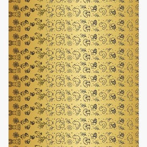 May include: A gold-colored sheet featuring a repeating pattern of black line art illustrations. The design includes rabbits, flowers, bees, chicks, elephants, ducks, and fish arranged in horizontal rows across the metallic surface.