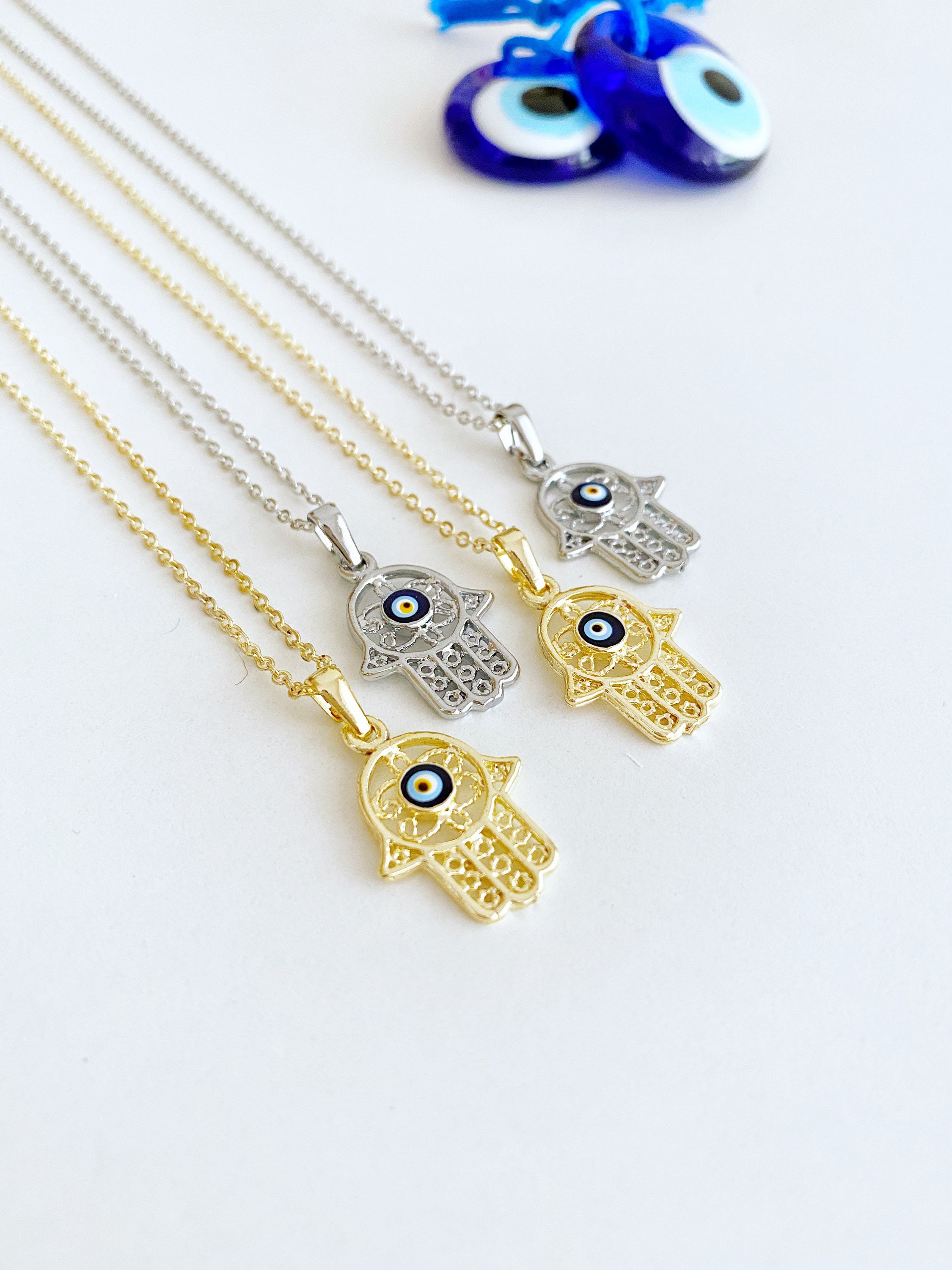 Intricate Hamsa and Evil Eye Necklace in Blue and Gold