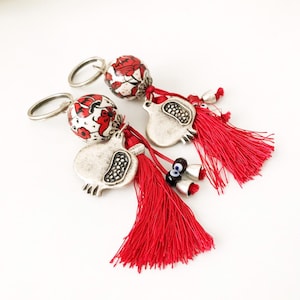 Evil eye keychain, pomegranate keychain, evil eye bag accessories, ceramic evil eye key chaim, red tassel keychain, silver pomegranate charm image 1