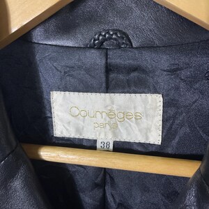 May include: Black leather jacket with a label that reads "Courr&egrave;ges Paris" and a size tag that says "38".