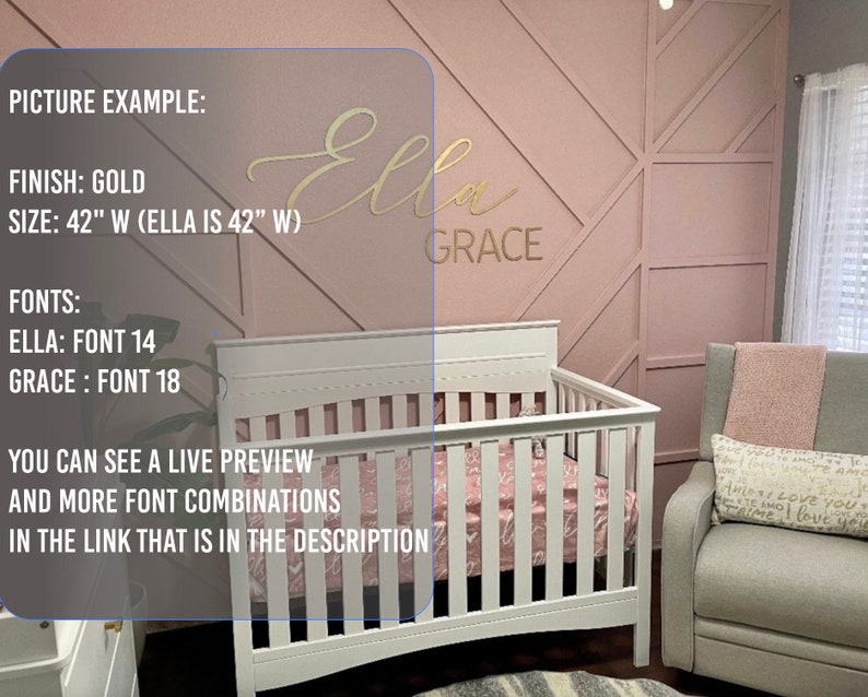 May include: Gold-colored vinyl wall decal with the names "Ella" and "Grace" in a cursive font. The decal is displayed on a pink wall with a geometric pattern. The decal is 42 inches wide. The text "FINISH: GOLD" and "SIZE: 42" W (ELLA IS 42" W)" is visible in the image.