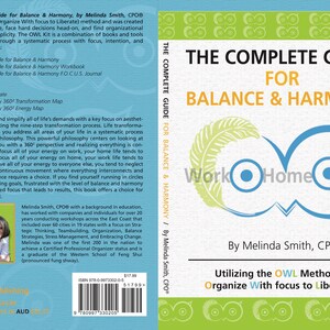 May include: The Complete Guide for Balance & Harmony book cover features a blue owl with the words "Work Home You" inside the eyes. The book cover is white with a green feather design. The book title is in black text and the author's name is in blue text. The book subtitle is "Utilizing the OWL Method - Organize With focus to Liberate!"