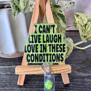 I Can&#39;t Live Laugh Love in These Conditions Badge Reel