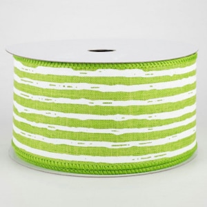 May include: A spool of green and white striped ribbon. The ribbon has a white background with green stripes.