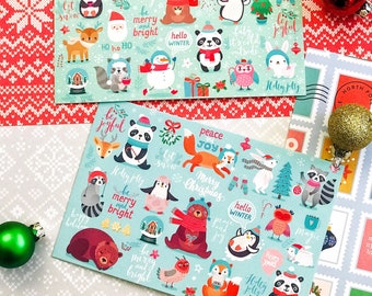 May include: Two Christmas cards with a blue background and a variety of winter animals and holiday-themed illustrations. The cards feature text such as "Merry Christmas", "Peace and Joy", "Be Merry and Bright", "Hello Winter", and "Ho Ho Ho".