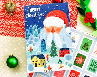 May include: A Christmas card with a blue background and a cartoon Santa Claus with a white beard. The card features a winter scene with houses, trees, and people. The text "Merry Christmas" is written in red and white letters.