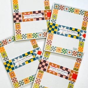 May include: Four rectangular notepads featuring a border of colorful quilt-inspired square patterns in shades of orange, yellow, green, and brown. Each notepad has a paper band printed with the text Autumn Quilt Notepad and Etsy/ArtfulQuiltCreations.