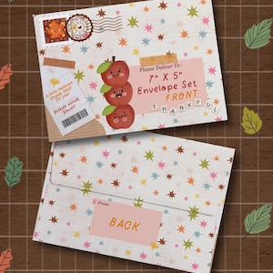 May include: A 7 inch by 5 inch envelope set featuring a white background with colorful star patterns. The front displays a stack of three cartoon apples, a postage stamp, and text reading Please Deliver To: 7" X 5" Envelope Set FRONT THANKFUL.