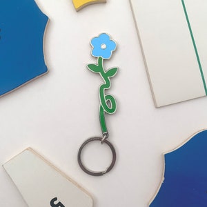 Flower Keychain – Double Sided Green and Yellow Enamel Accessory