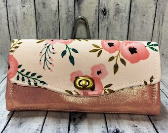Necessary clutch wallet, NCW, wristlet, wallet, faux leather, printed cotton flowers and pinkish coral shinny faux leather.
