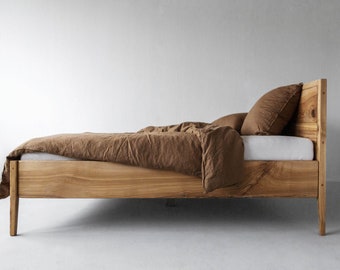 Bed made of Janne solid ash wood with backrest