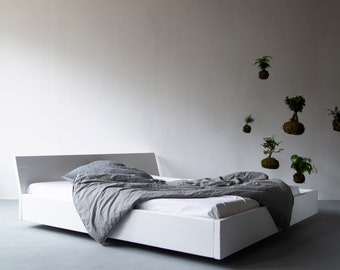 Lussan timber bed with white coverage and slanted backrest