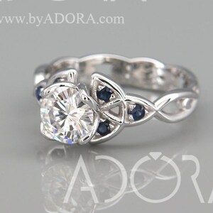 14k White Gold Celtic Trinity Knot Wedding Ring set with Moissanite and Blue Sapphire | Charles and Colvard Celtic Triquetra Engagement Ring