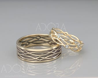 May include: Two gold wedding bands, one with a textured design and the other with a delicate, openwork design featuring small diamonds.
