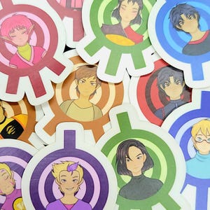 Puede incluir: Un conjunto de pegatinas coloridas con personajes de dibujos animados con diferentes peinados y ropa. Cada pegatina tiene un diseño circular con un patrón de diana.