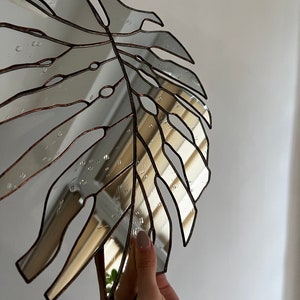 Botanical mirror decor inspired by tropical plants