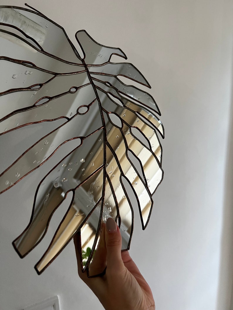 Botanical mirror decor inspired by tropical plants