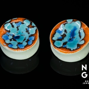 1 pair of 36mm (1.7/16") CERAMIC ear stretchers, glass ear plugs, unique gauges