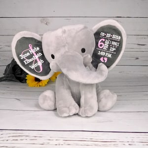May include: Gray plush elephant with embroidered ears. One ear says "June Kate Elizabeth Waugh" and the other ear says "03-25-2019 6 pounds 3 ounces 19" 1:59 P.M."