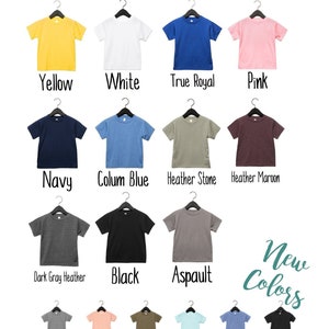 May include: A chart showing different colors of kids' t-shirts. The colors include yellow, white, true royal blue, pink, navy, colum blue, heather stone, heather maroon, dark gray heather, black, aspault, grey triblend, peach triblend, olive triblend, ice blue triblend, blue triblend, and char black triblend.