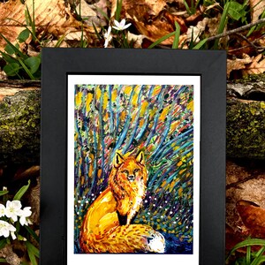 May include: A framed art print featuring a vibrant painting of a fox. The fox has orange and white fur, set against a colorful background of blues, yellows, and greens. The frame is black.