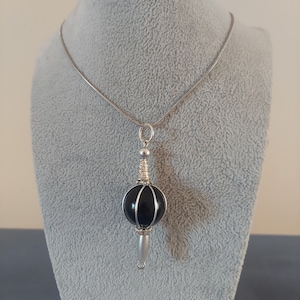 Grief seed necklace Madoka Magica witch subtle abstract fandom merch
