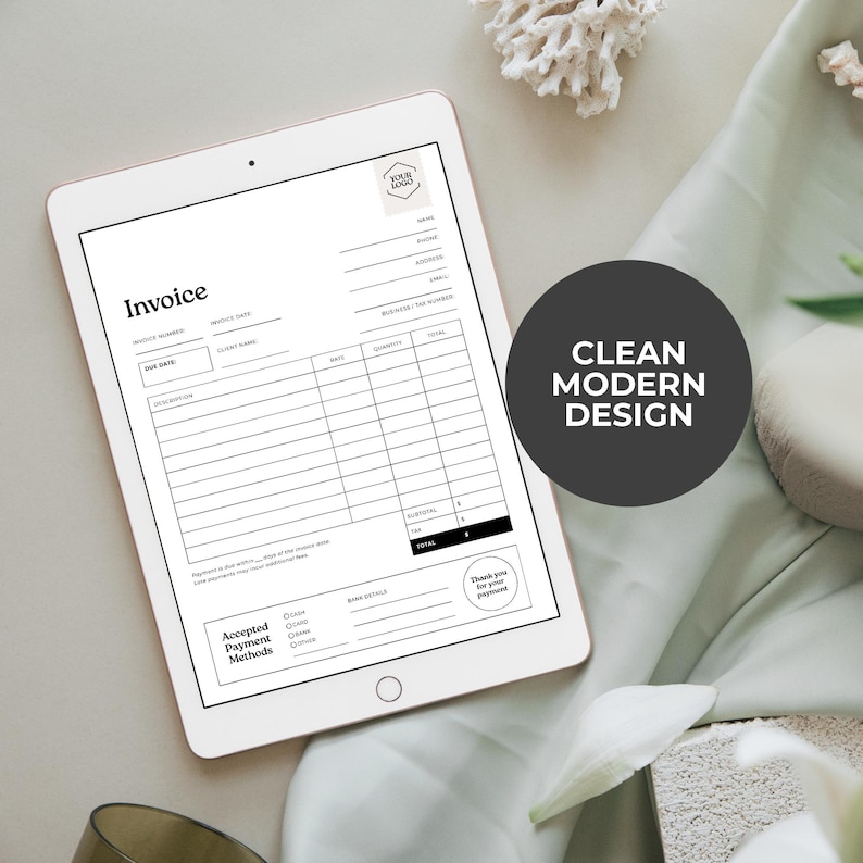 May include: A digital tablet displaying a black and white invoice template. The invoice includes fields for invoice number, client name, and item descriptions. A circular graphic on the right reads "Clean Modern Design."