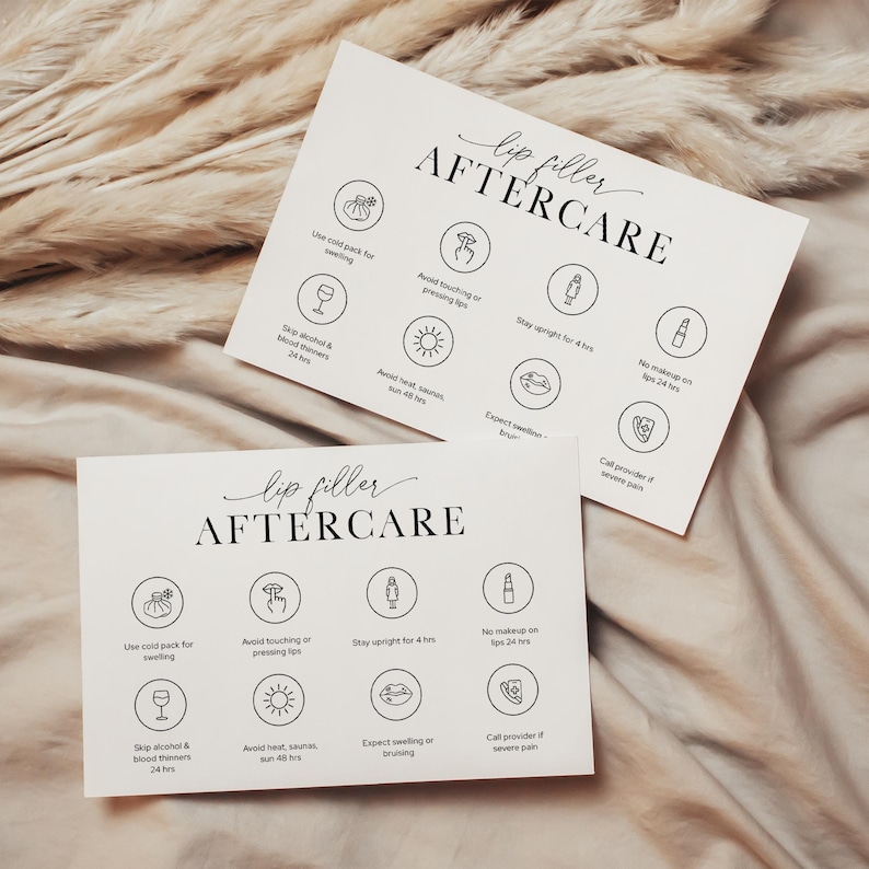 May include: Two white cards with the text "lip filler AFTERCARE" in elegant script. Each card features illustrated icons with instructions, including "Use cold pack for swelling" and "Avoid touching or pressing lips."